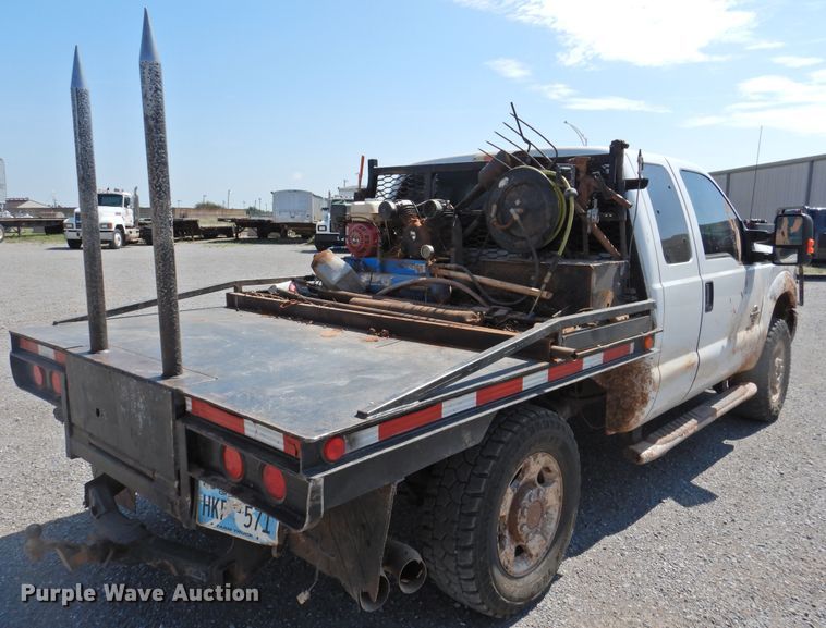 image for item DK2429 2015 Ford F250 Super Duty  SuperCab bale bed pickup truck