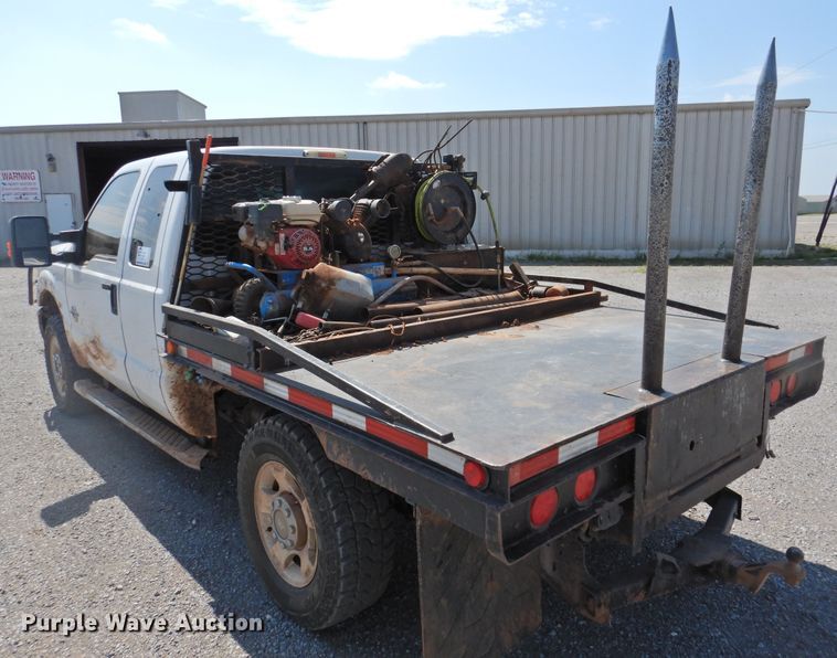 image for item DK2429 2015 Ford F250 Super Duty  SuperCab bale bed pickup truck