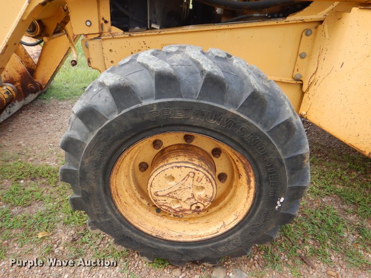 image for item DM3967 1997 John Deere 310E  backhoe