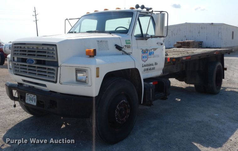 image for item JG9144 1987 Ford F700  flatbed truck