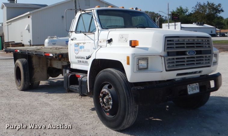 image for item JG9144 1987 Ford F700  flatbed truck