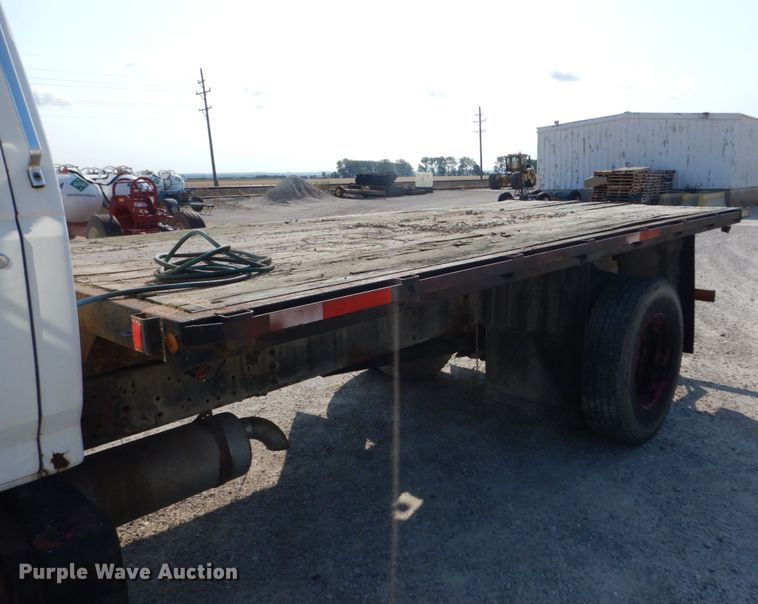 image for item JG9144 1987 Ford F700  flatbed truck