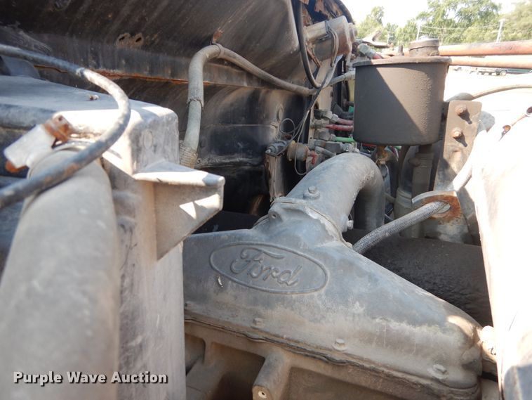 image for item JG9144 1987 Ford F700  flatbed truck