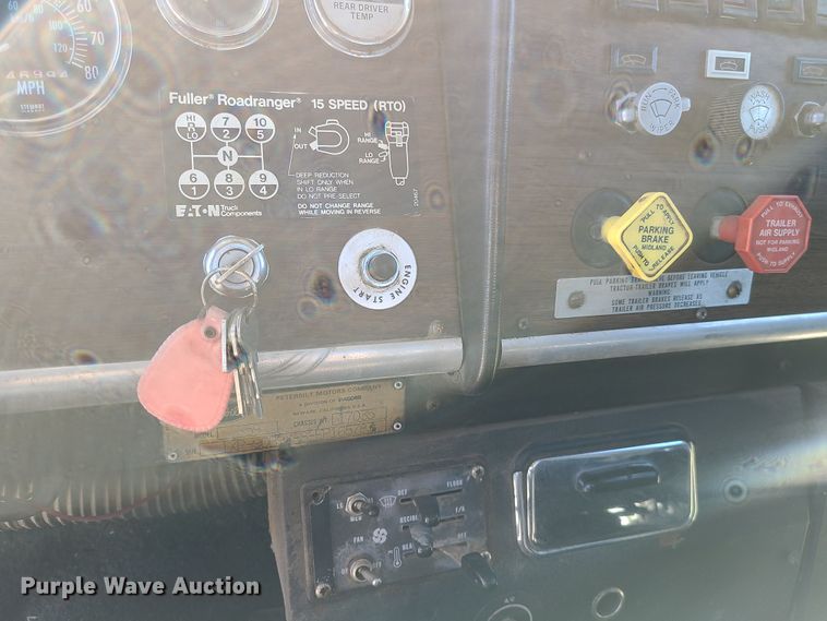 image for item IC9988 1984 Peterbilt 359  roll-off container truck