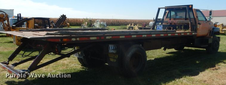 image for item JG9129 2002 GMC 7500  rollback truck