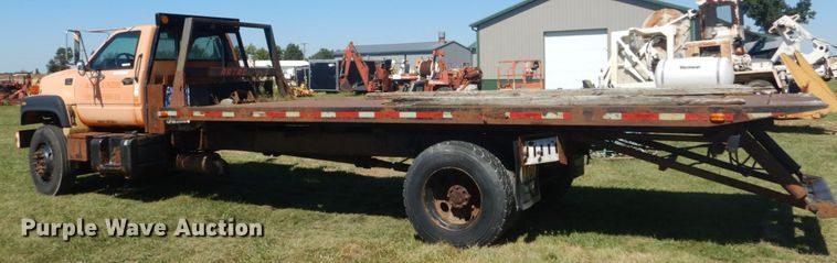 image for item JG9129 2002 GMC 7500  rollback truck