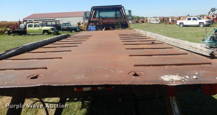 image for item JG9129 2002 GMC 7500  rollback truck