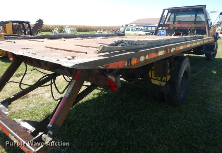 image for item JG9129 2002 GMC 7500  rollback truck