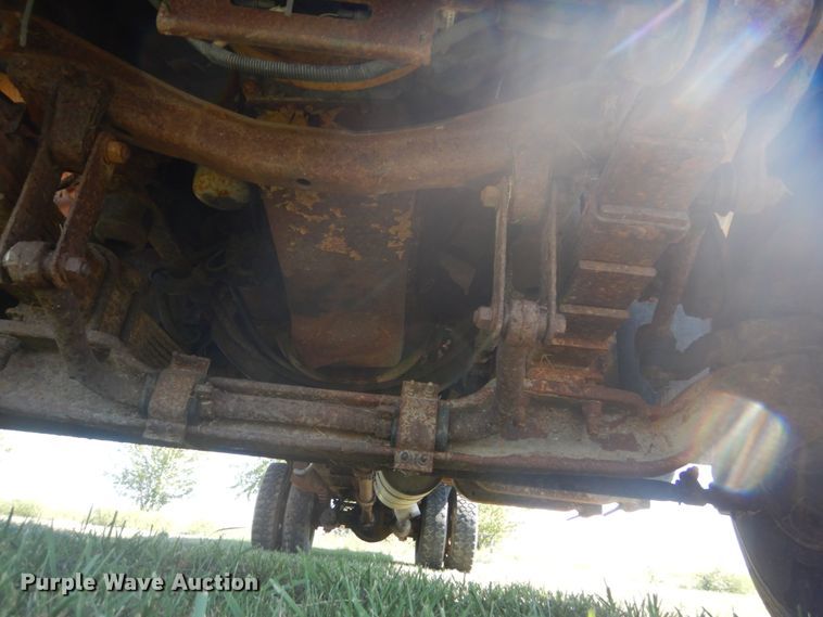 image for item JG9129 2002 GMC 7500  rollback truck