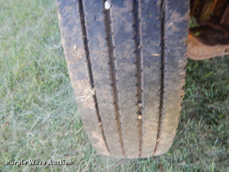 image for item JG9129 2002 GMC 7500  rollback truck