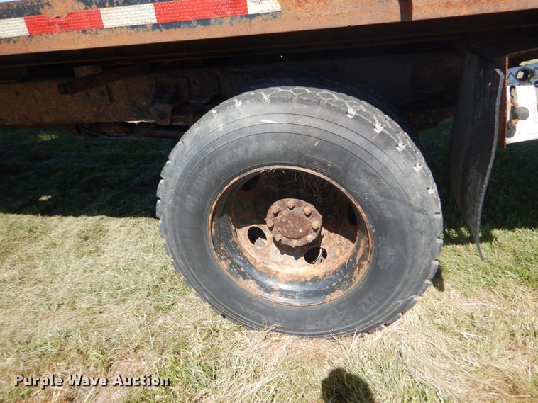 image for item JG9129 2002 GMC 7500  rollback truck