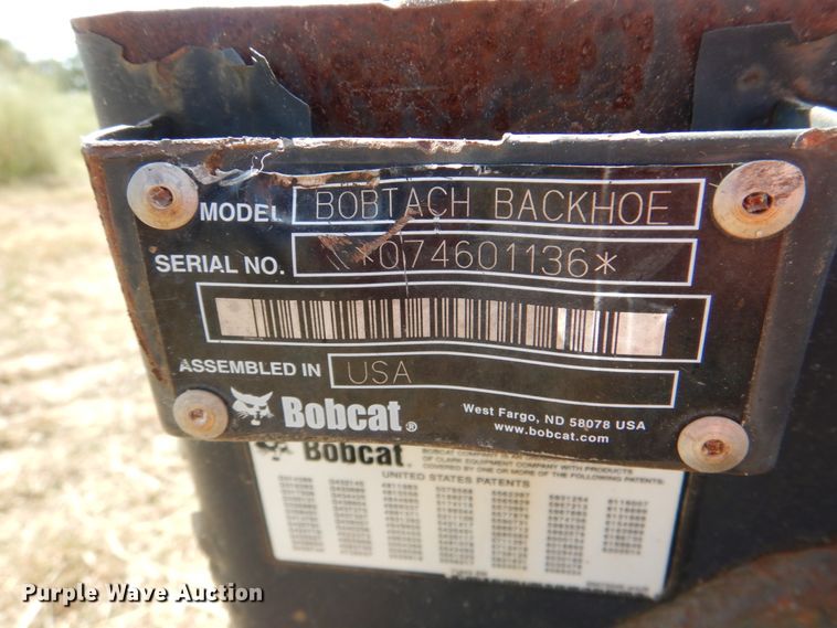 image for item KQ9718 Bobcat Bobtach skid steer backhoe