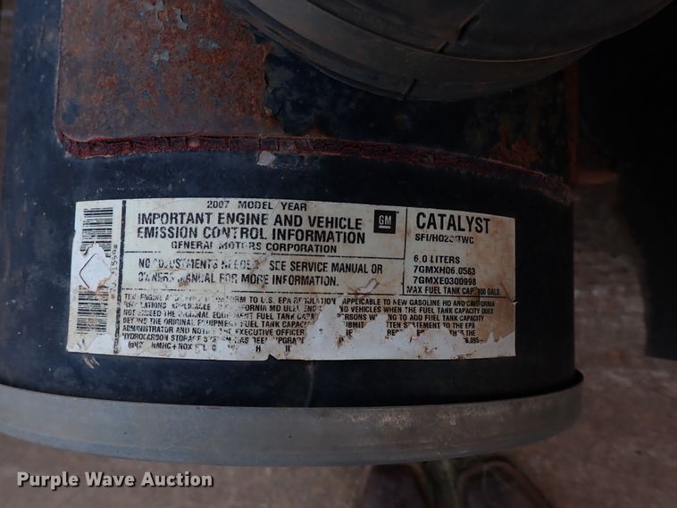 image for item IN9577 2007 GMC W3500  roll-off container truck