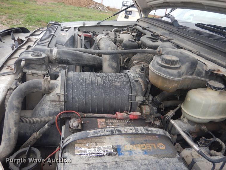 image for item JG9010 2005 Ford F550 Super Duty XLT  Crew Cab flatbed truck