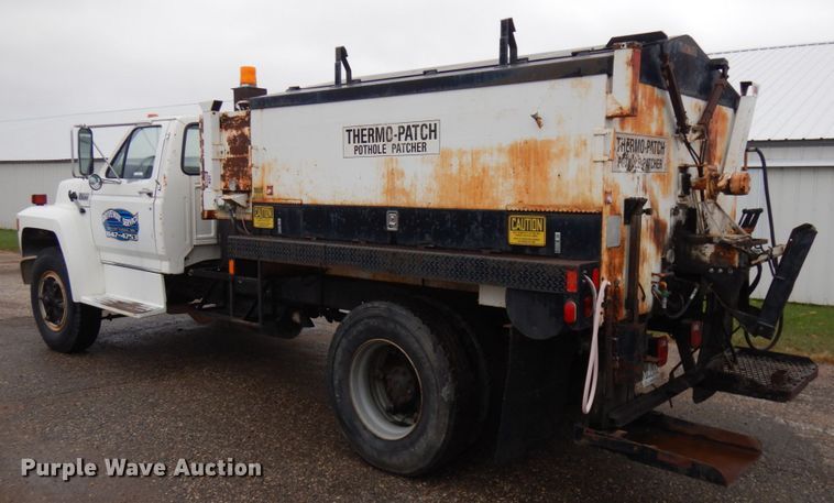 image for item JS9528 1991 Ford F700  pot hole patcher truck