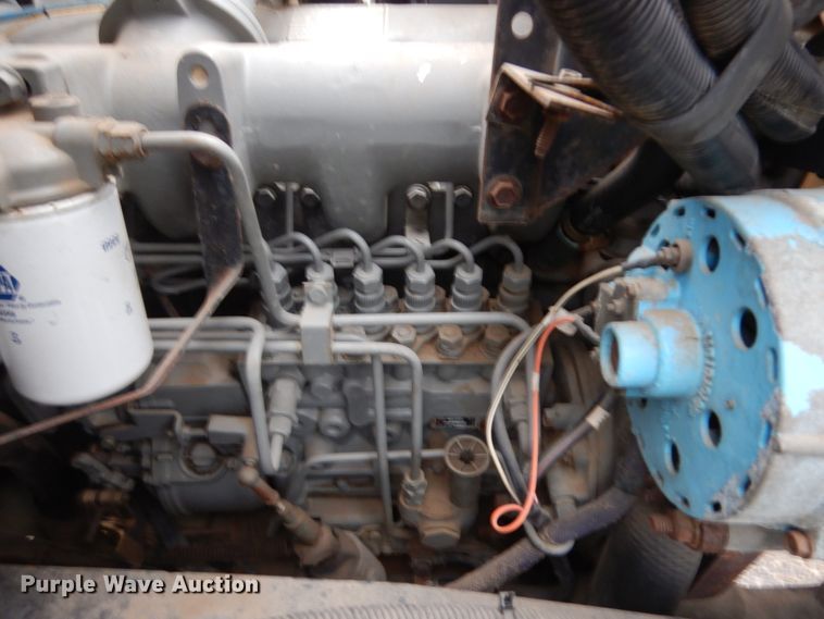 image for item JS9528 1991 Ford F700  pot hole patcher truck