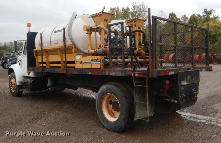 image for item IV9503 2001 International 4700  flatbed truck with mud mixer