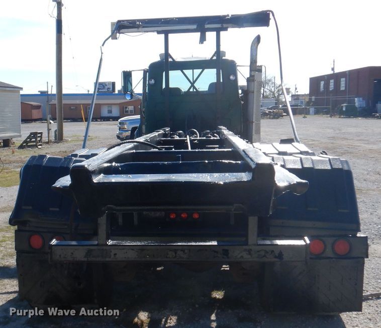 image for item DA5499 1999 Mack RD688S  roll-off container truck