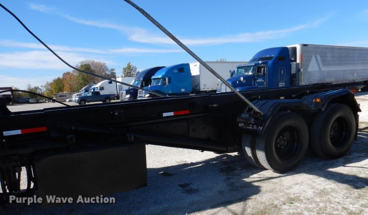 image for item DA5499 1999 Mack RD688S  roll-off container truck