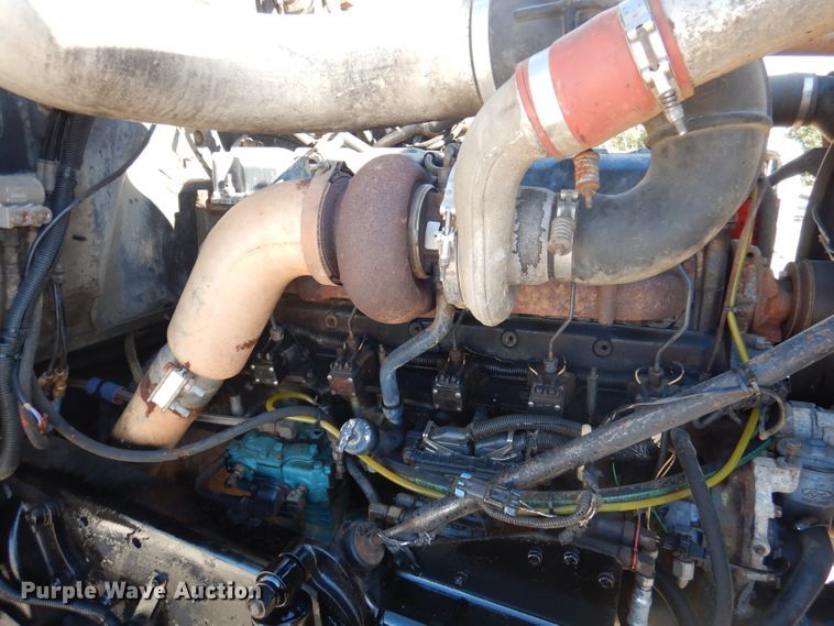 image for item DA5499 1999 Mack RD688S  roll-off container truck