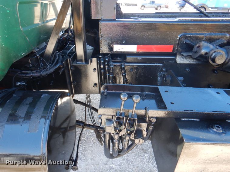 image for item DA5499 1999 Mack RD688S  roll-off container truck