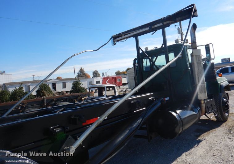 image for item DA5499 1999 Mack RD688S  roll-off container truck