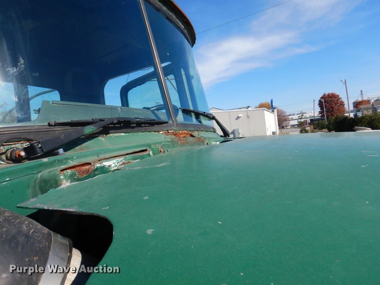 image for item DA5499 1999 Mack RD688S  roll-off container truck