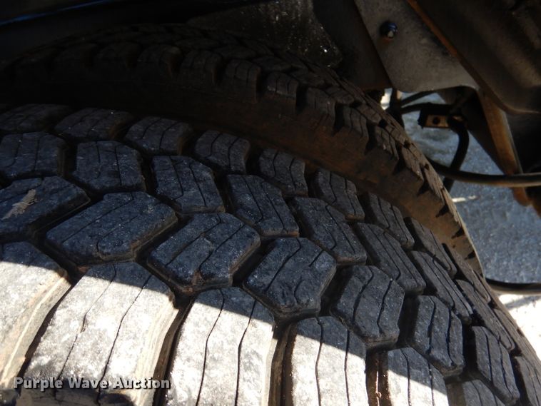 image for item DA5499 1999 Mack RD688S  roll-off container truck