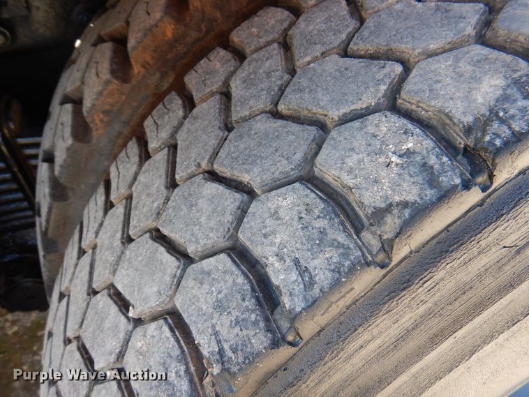 image for item DA5499 1999 Mack RD688S  roll-off container truck