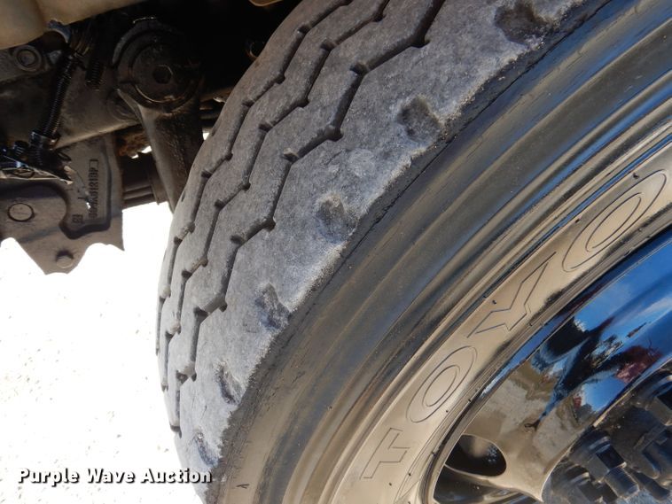 image for item DA5499 1999 Mack RD688S  roll-off container truck