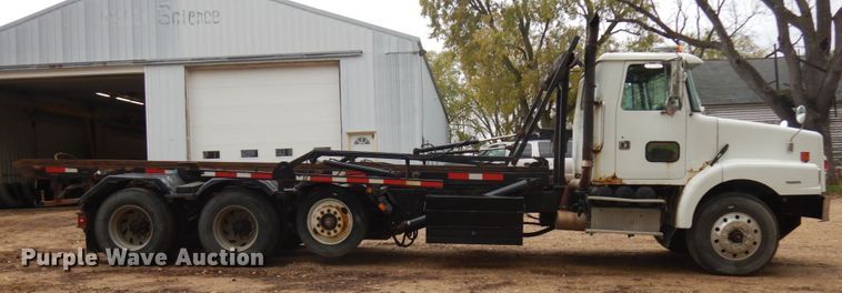 image for item JS9538 1999 Volvo WG  roll-off container truck