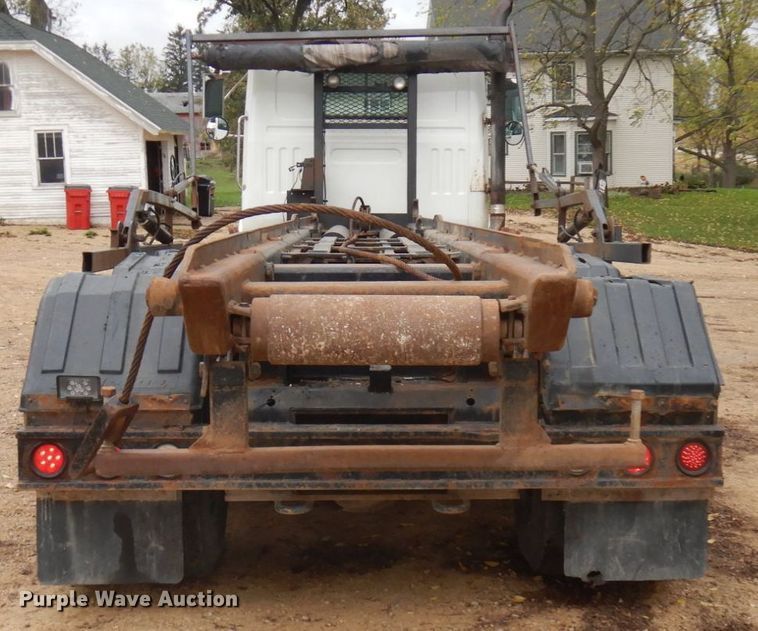 image for item JS9538 1999 Volvo WG  roll-off container truck