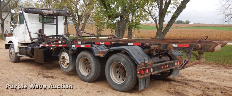 image for item JS9538 1999 Volvo WG  roll-off container truck