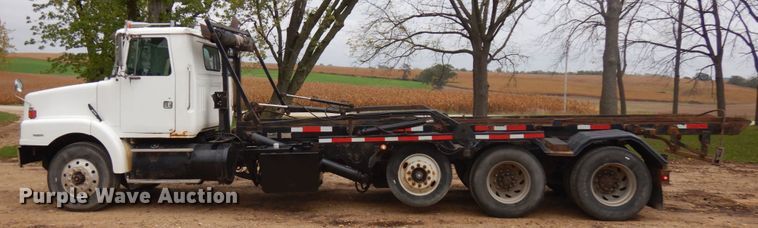 image for item JS9538 1999 Volvo WG  roll-off container truck