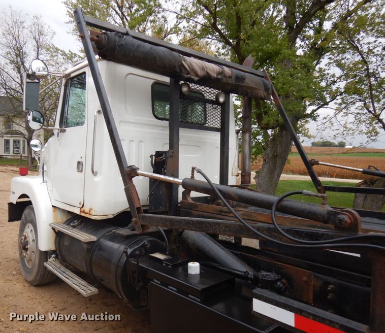 image for item JS9538 1999 Volvo WG  roll-off container truck