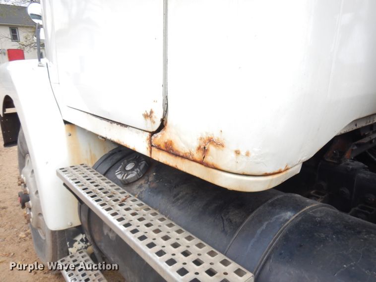 image for item JS9538 1999 Volvo WG  roll-off container truck