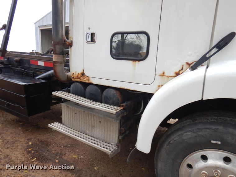 image for item JS9538 1999 Volvo WG  roll-off container truck