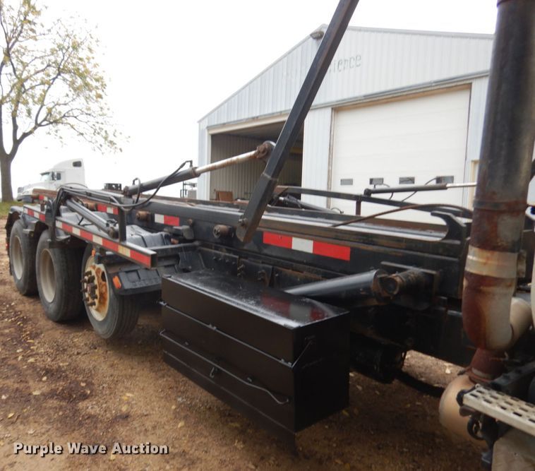 image for item JS9538 1999 Volvo WG  roll-off container truck