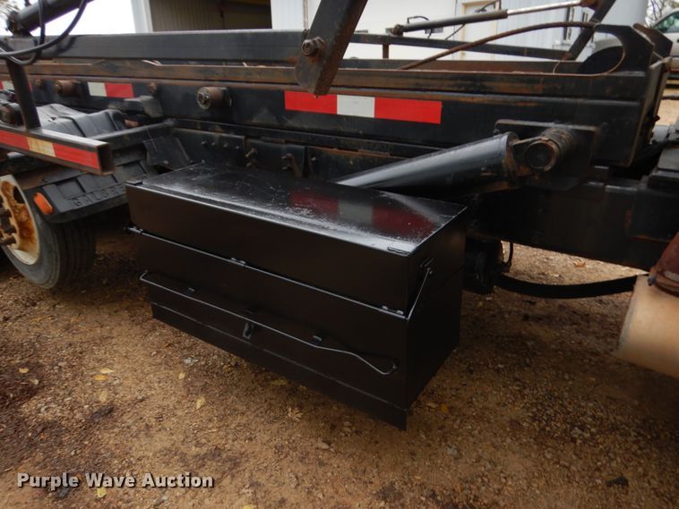 image for item JS9538 1999 Volvo WG  roll-off container truck