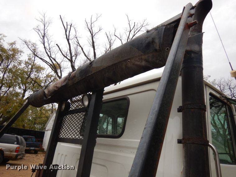 image for item JS9538 1999 Volvo WG  roll-off container truck