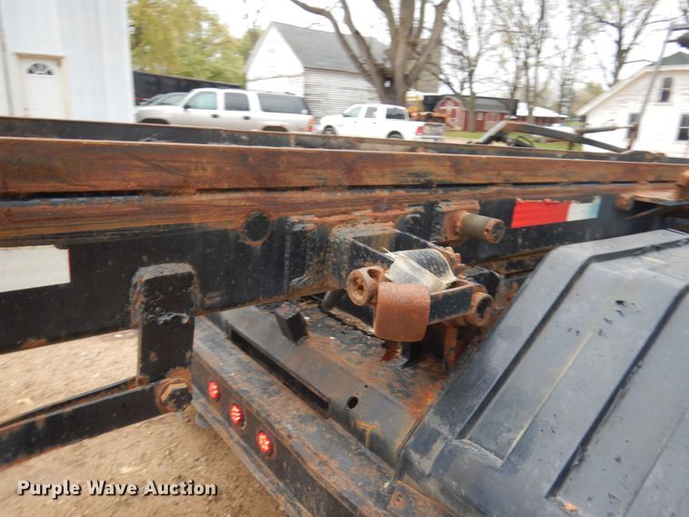 image for item JS9538 1999 Volvo WG  roll-off container truck