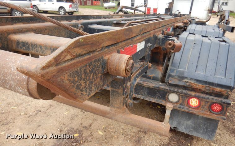 image for item JS9538 1999 Volvo WG  roll-off container truck