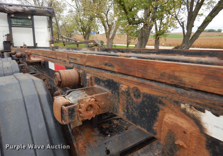 image for item JS9538 1999 Volvo WG  roll-off container truck