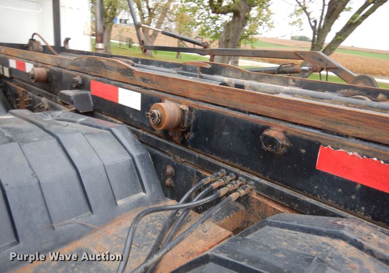 image for item JS9538 1999 Volvo WG  roll-off container truck