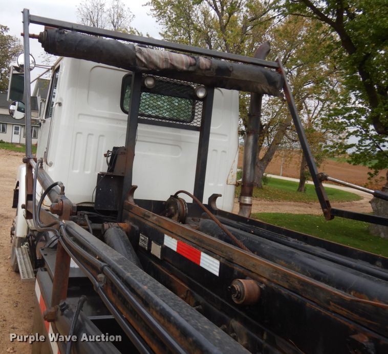 image for item JS9538 1999 Volvo WG  roll-off container truck