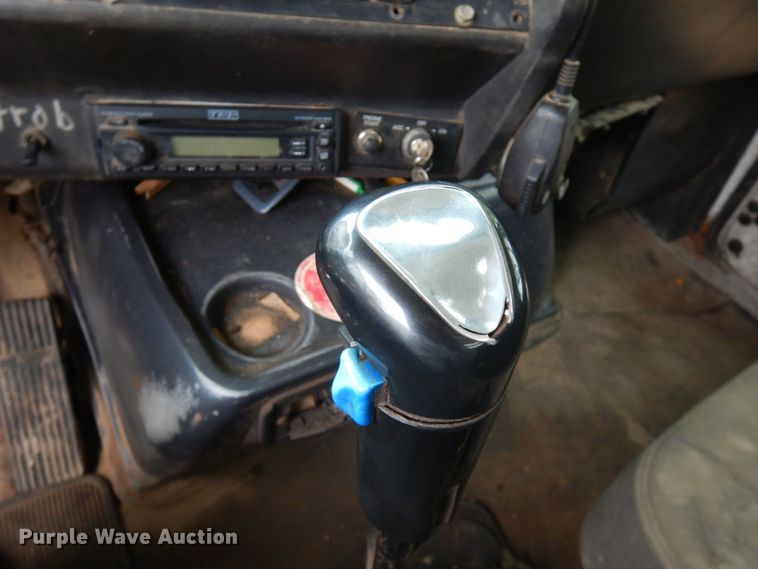 image for item JS9538 1999 Volvo WG  roll-off container truck