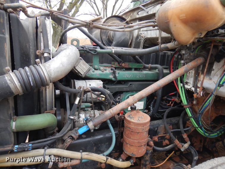 image for item JS9538 1999 Volvo WG  roll-off container truck