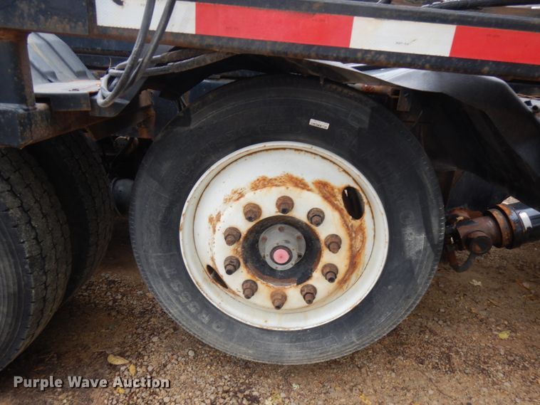 image for item JS9538 1999 Volvo WG  roll-off container truck