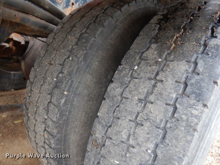 image for item JS9538 1999 Volvo WG  roll-off container truck