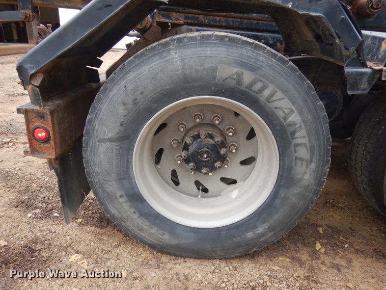 image for item JS9538 1999 Volvo WG  roll-off container truck